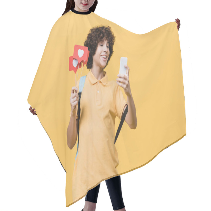 Personality  Curly Teenager Smiling While Holding Paper Hearts On Sticks And Smartphone Isolated On Yellow Hair Cutting Cape