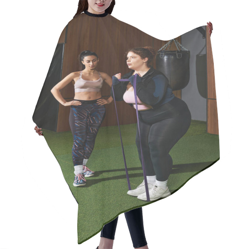 Personality  Two Women Engage In A Workout, With One Coaching The Other In Resistance Training Techniques. Hair Cutting Cape