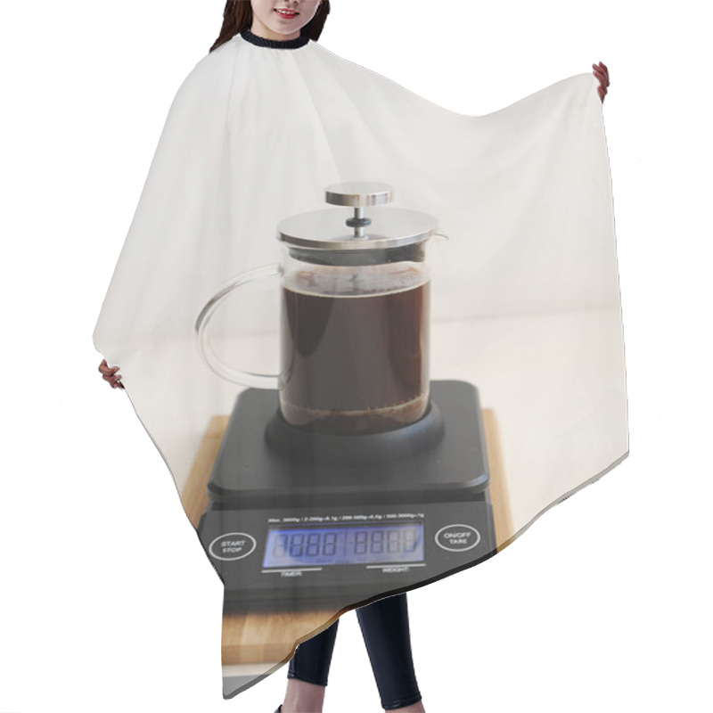 Personality  Brewing Coffee In French Press. Plunger Down. On Black Electronic Timer Scales. Hair Cutting Cape