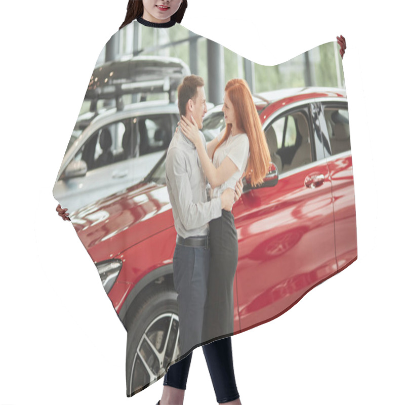 Personality  Couple Hugging While Buying First New Family Car Together In Dealership. Hair Cutting Cape