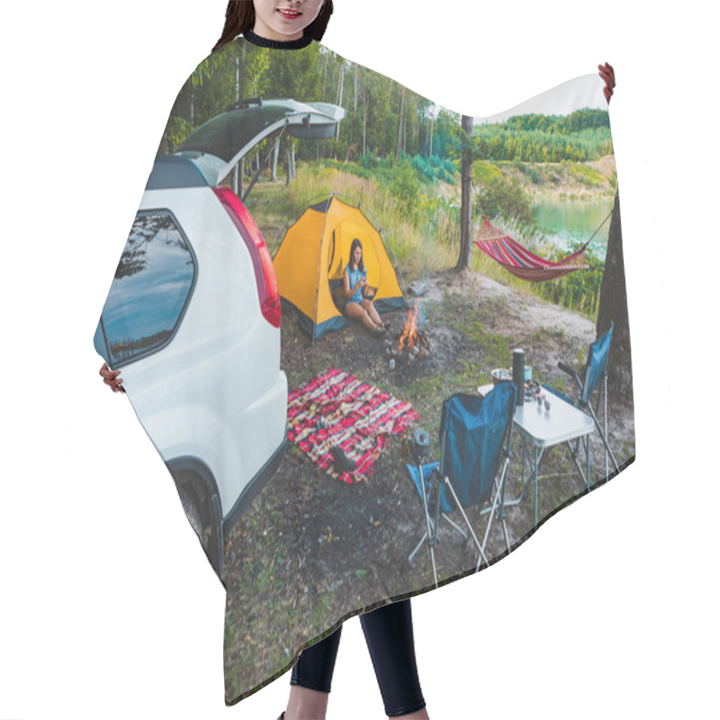 Personality  Camping Near Lake. Woman Sitting In Yellow Tent. White Suv Car. Hiking Concept Hair Cutting Cape