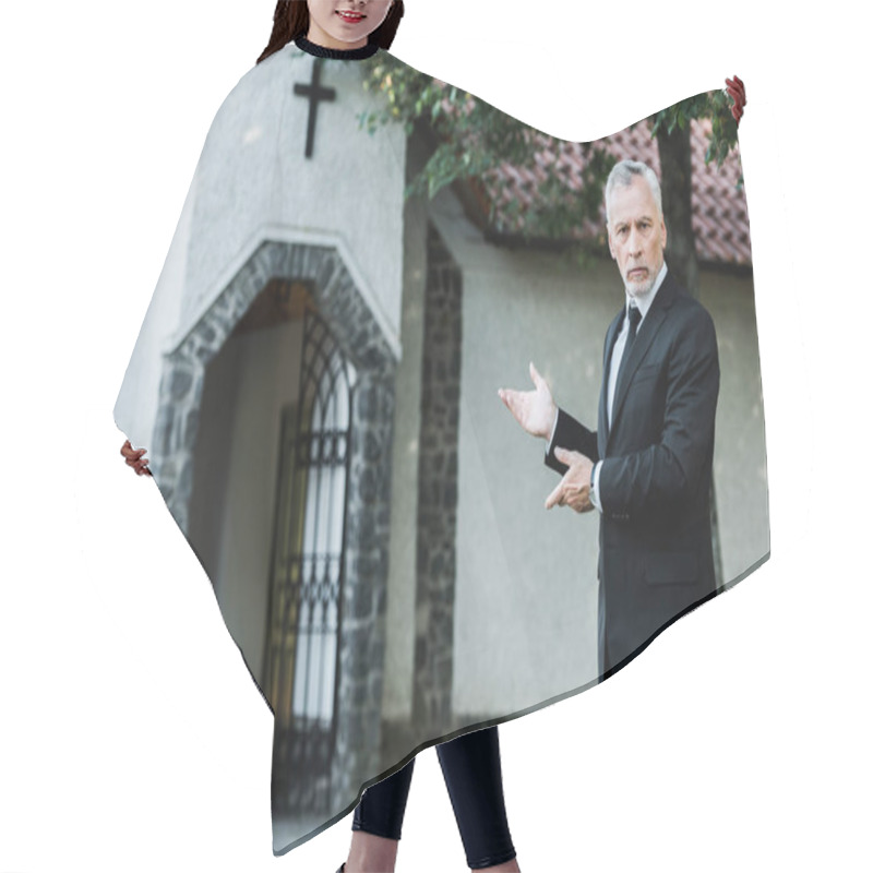 Personality  Handsome Senior Man In Suit Gesturing Near Church  Hair Cutting Cape