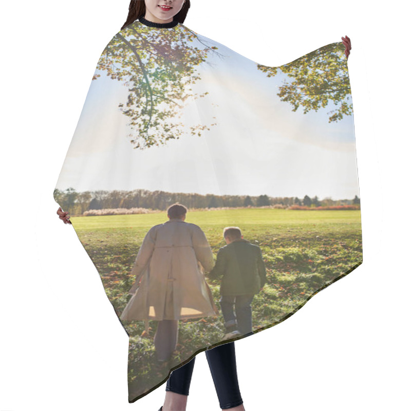 Personality  Back View, Mother And Son Walking In Park, Hold Hands, Autumn, Fall Season, Trees, African American Hair Cutting Cape