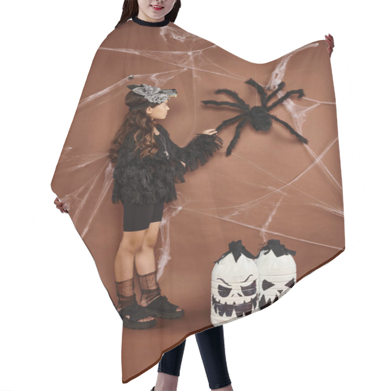 Personality  Cute Girl In Wolf Mask And Black Attire Touches Spider On Brown Backdrop, Halloween Concept Hair Cutting Cape