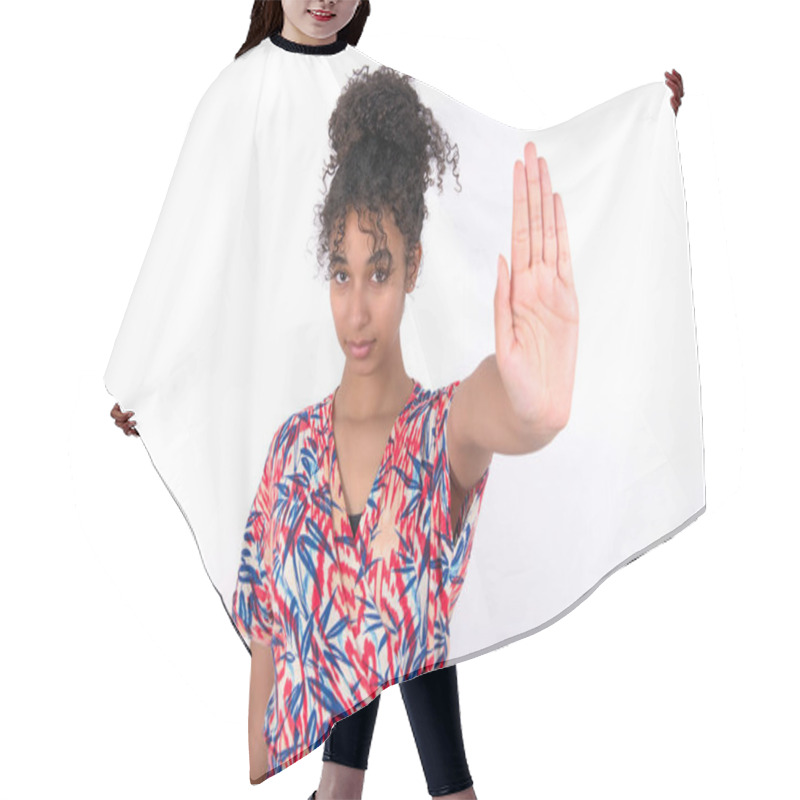 Personality  Girl Doing Stop Gesture With Palm Of The Hand. Warning Expression With Negative And Serious Gesture On The Face. Young Beautiful Mixed Race Woman Wearing Colourful Dress Over White Wall Hair Cutting Cape