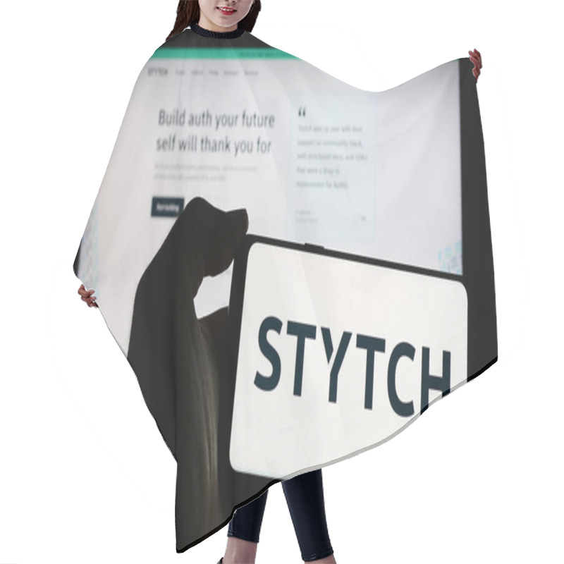 Personality  Stuttgart, Germany - 05-14-2024: Person Holding Mobile Phone With Logo Of American Identity Platform Company Stytch Inc. In Front Of Business Web Page. Focus On Phone Display. Hair Cutting Cape