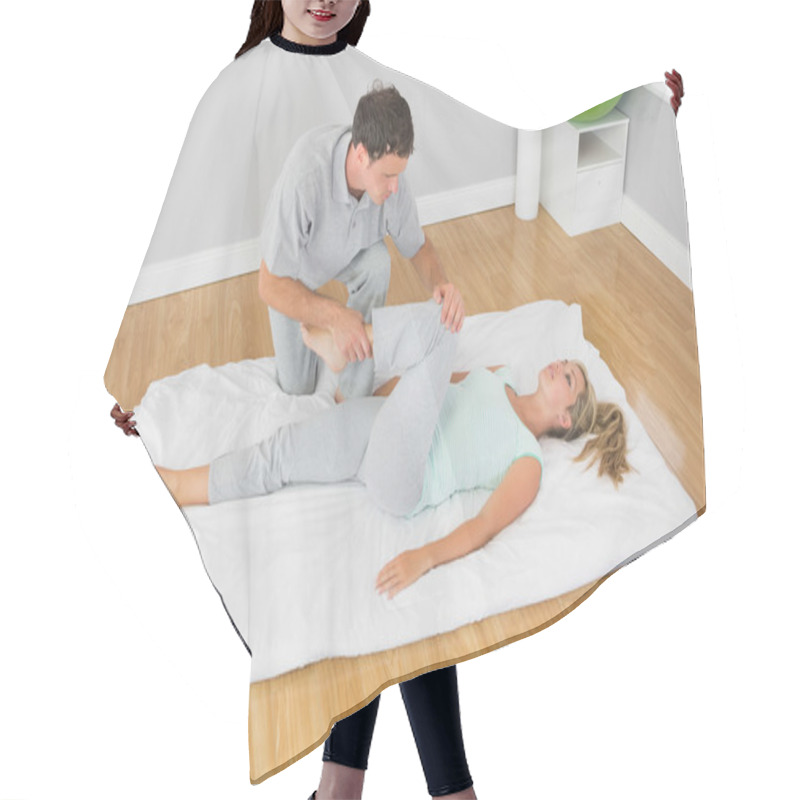 Personality  Physiotherapist Treating Patients Leg On A Mat On The Floor Hair Cutting Cape