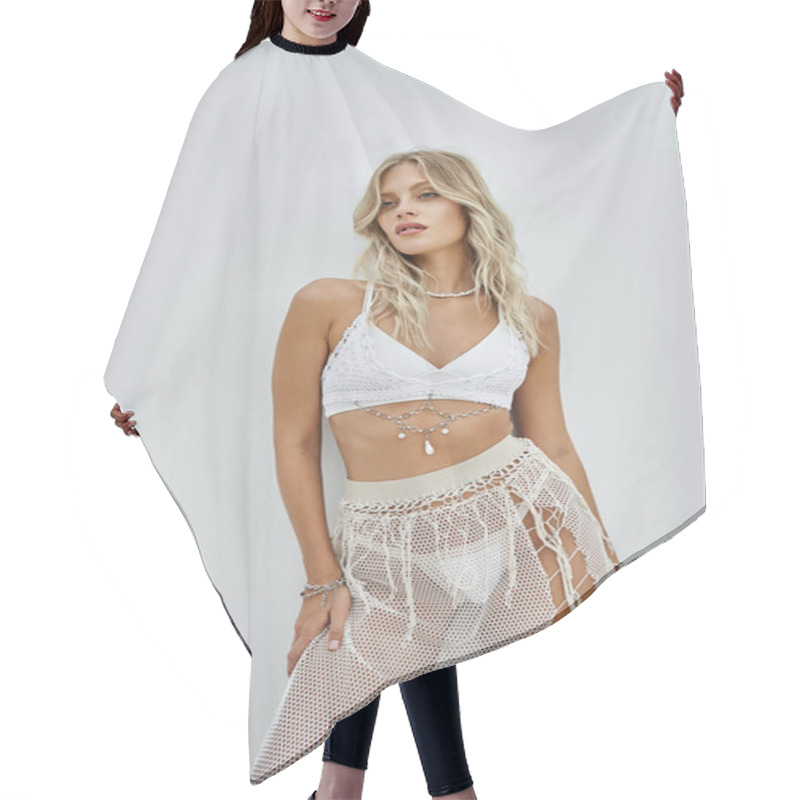 Personality  A Young Woman Poses In A Stylish White Crochet Bikini Top And Skirt Against A White Background. Hair Cutting Cape