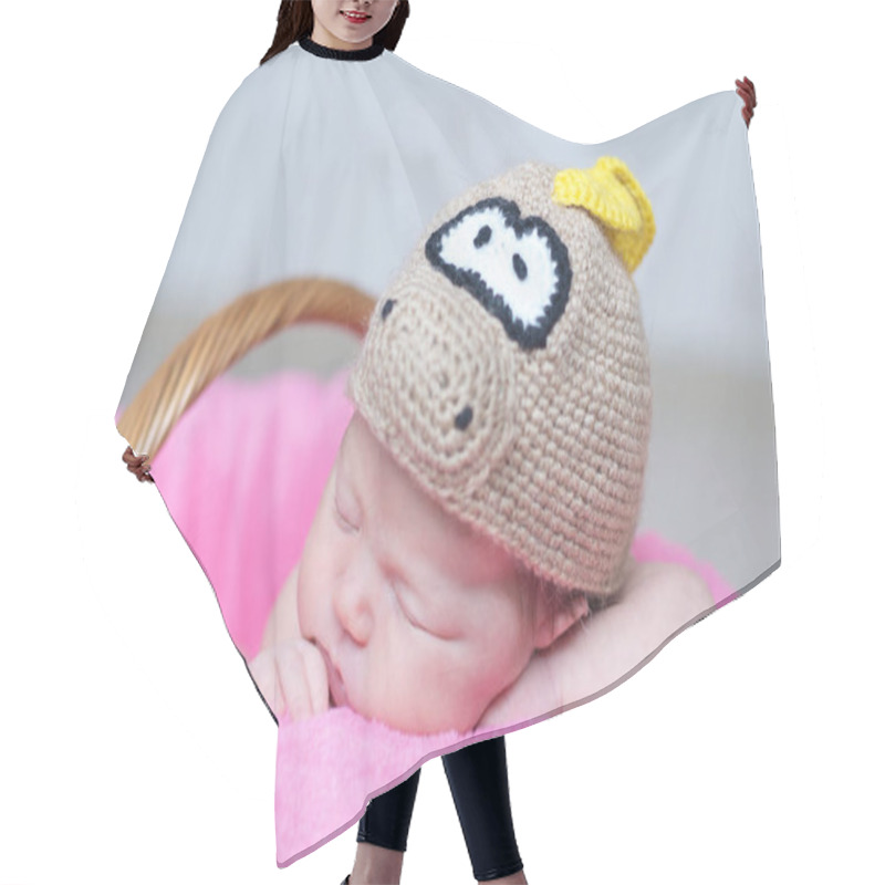 Personality  Cute Happy Newborn Baby In Dragon Knitted Cap Sleeping In Basket On Pink Blanket. Infant Sleeping Portrait. Hair Cutting Cape