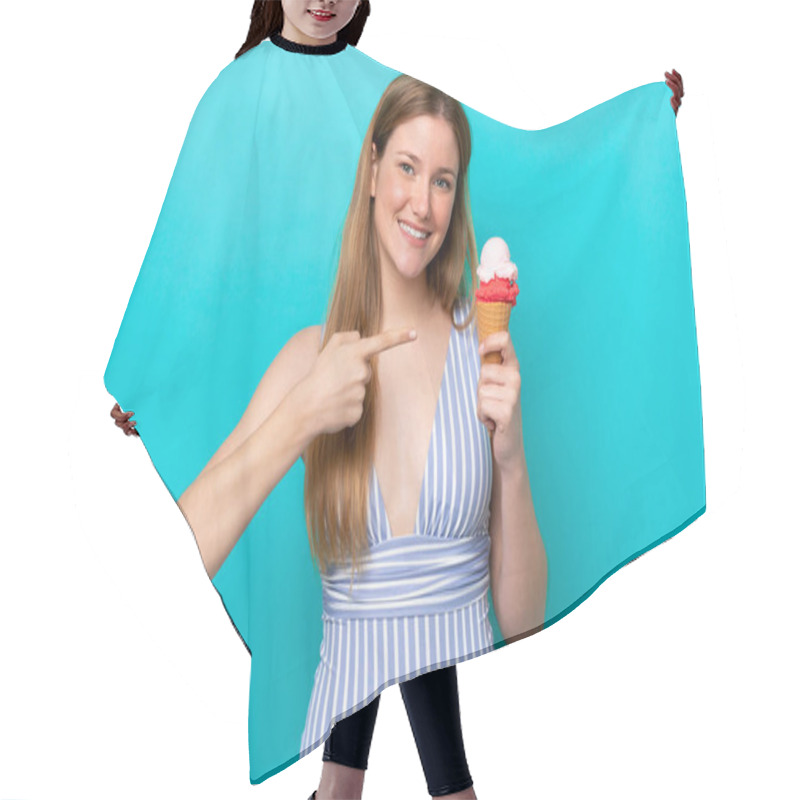 Personality  Young Caucasian Woman In Swimsuit Eating Ice Cream Isolated On Blue Background And Pointing It Hair Cutting Cape