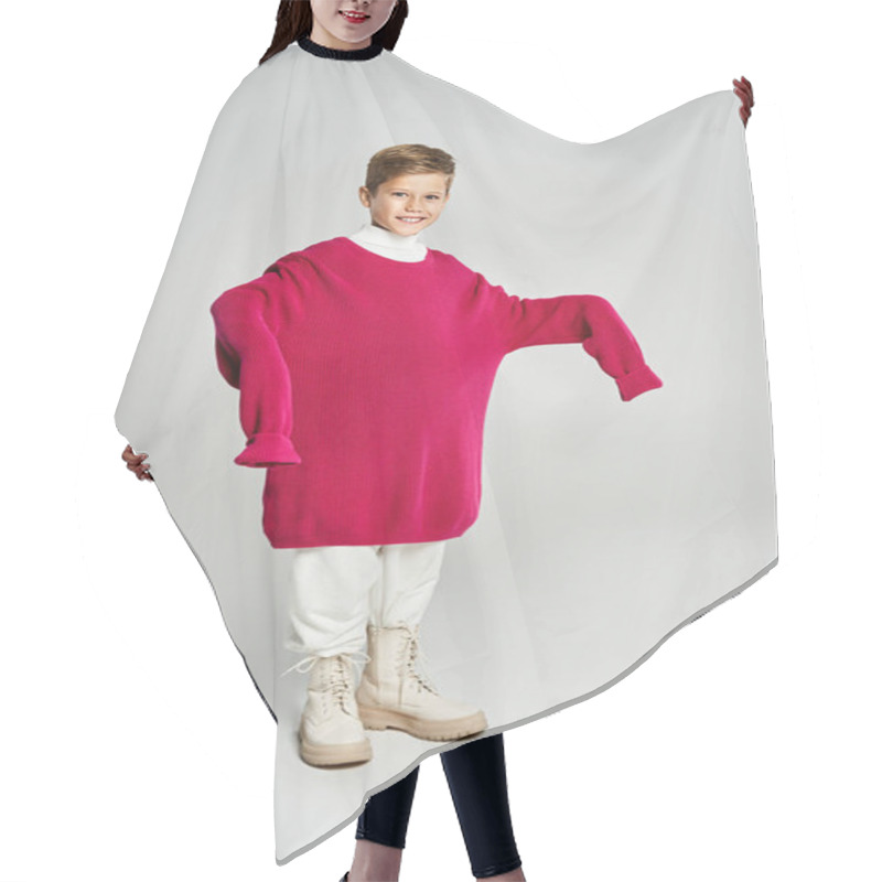 Personality  A Boy Enjoys The Winter In A Large, Warm Sweater With A Cheerful Expression. Hair Cutting Cape