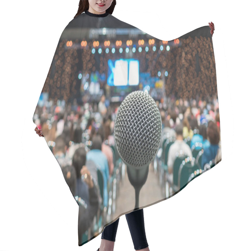 Personality  Microphone Over The Abstract Blurred Photo Of Conference Hall Or Seminar Room In Exhibition Center Background With Speakers On The Stage And Attendee Background, Business Meeting And Education Concept Hair Cutting Cape