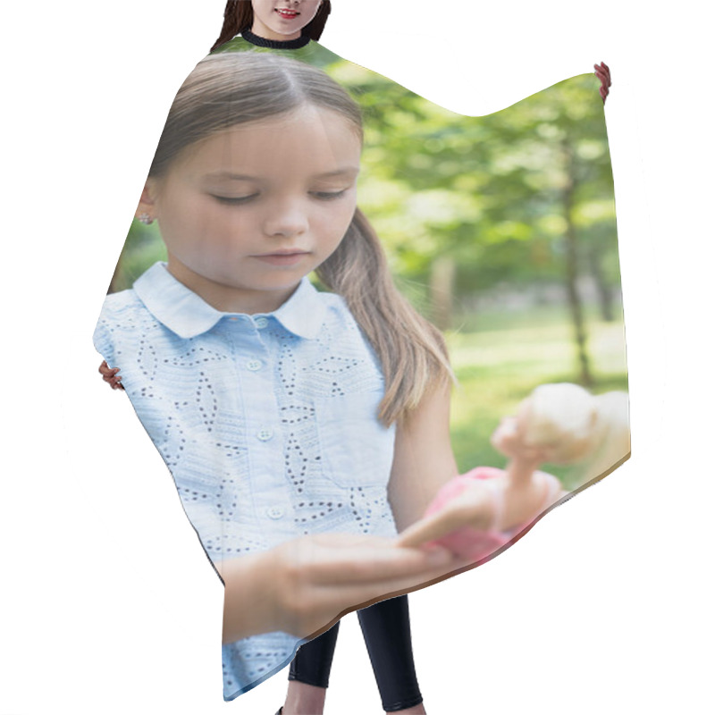 Personality  Girl In Sleeveless Blouse Holding Blurred Doll Outdoors Hair Cutting Cape