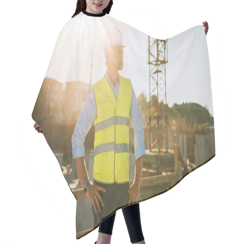 Personality  Confident Bearded Head Civil Engineer-Architect In Sunglasses Stands In A Construction Site On A Sunny Bright Day. Man Is Wearing A Hard Hat, Shirt, Jeans And A Yellow Safety Vest.  Hair Cutting Cape