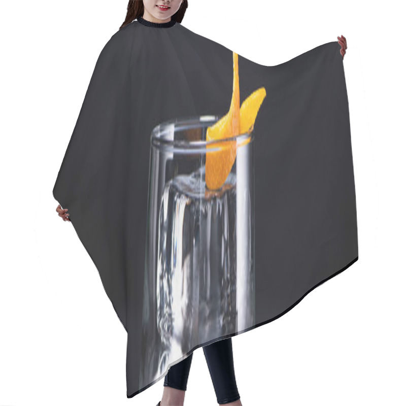 Personality  Transparent Glass With Ice Cube And Vodka Garnished With Orange Peel Isolated On Black, Panoramic Shot Hair Cutting Cape