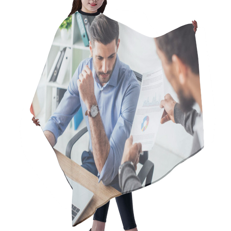 Personality  Selective Focus Of African American Businessman Holding Paper With Charts Near Colleague In Office Hair Cutting Cape