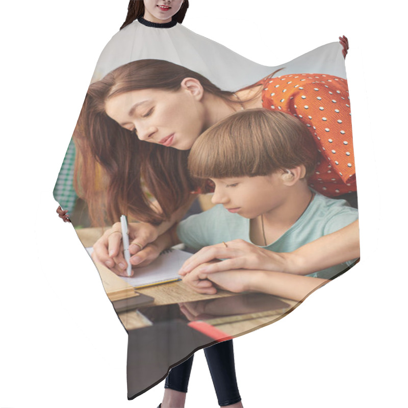 Personality  A Mother Gently Assists Her Son With His Writing In A Cozy Setting. Hair Cutting Cape