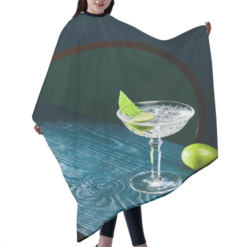 Personality  High Angle View Of Cocktail Glass With Mint Leaf And Whole Lime On Blue Wooden Surface On Geometric Background With Circle Hair Cutting Cape