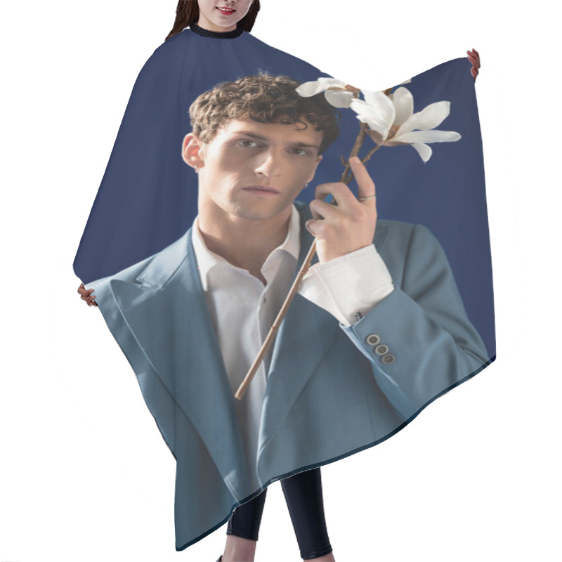 Personality  Portrait Of Stylish Young Man In Jacket Holding Magnolia Flowers Isolated On Navy Blue  Hair Cutting Cape