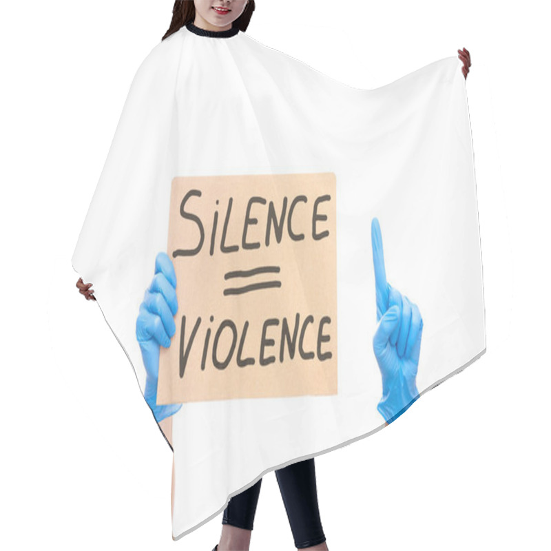 Personality  Protest Shows Index Finger Up And  Hand On Glove Holding A Cardboard Poster With The Message Text Silence Is Violence Isolated On White Background, Concept On The Theme Of Protest At Police Brutality. Hair Cutting Cape