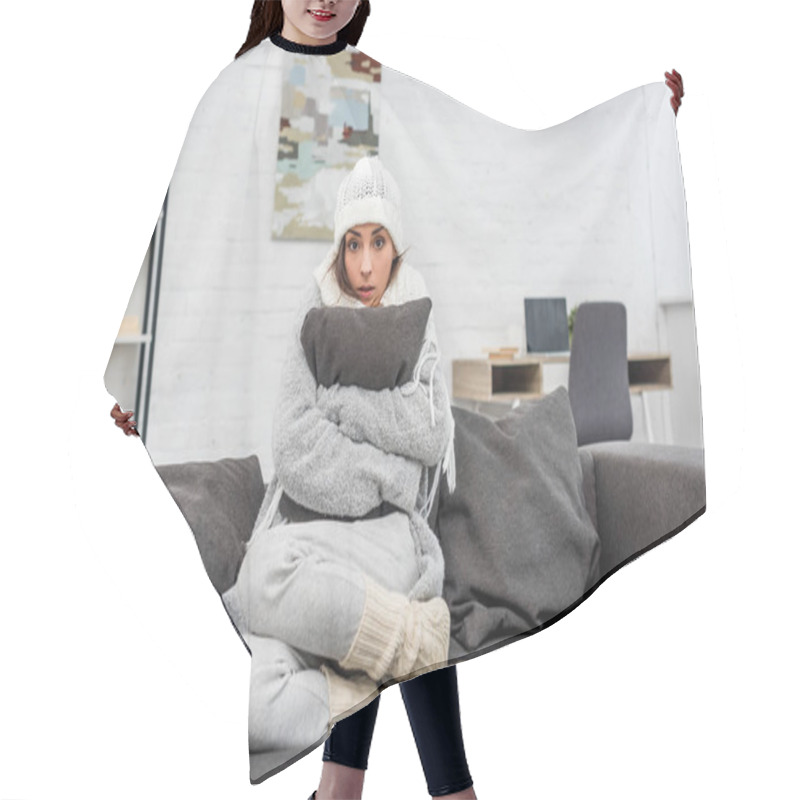 Personality  Freezed Young Woman In Warm Clothes Sitting On Couch And Hugging Cushion At Home Hair Cutting Cape