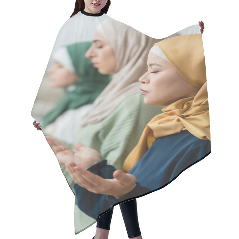 Personality  Side View Of Asian Woman In Hijab Praying Near Blurred Muslim Daughter And Granddaughter At Home  Hair Cutting Cape