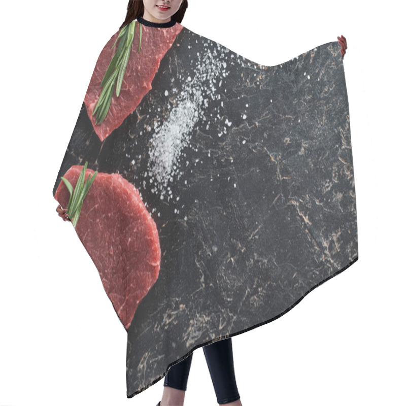 Personality  Top View Of Raw Beef Steaks With Rosemary Twigs On Black Marble Surface With Scattered Salt Crystals Hair Cutting Cape