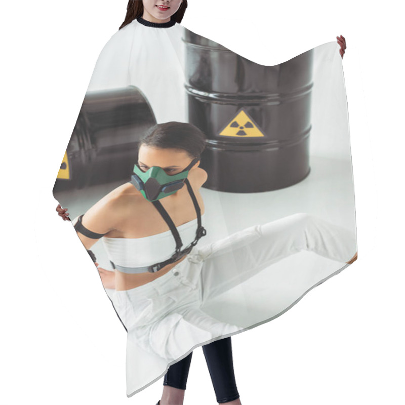 Personality  Futuristic African American Woman In Safety Mask With Gun Near Radioactive Waste Barrels On White Background Hair Cutting Cape