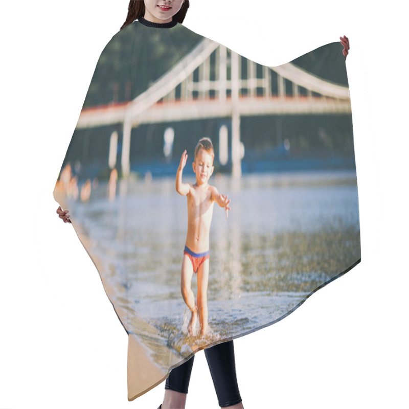 Personality  Theme Summer Outdoor Activities Near The River On The City Beach In Kiev Ukraine. Little Funny Baby Boy Running Along The River Bank, Jumping A Splash Of Water Sandy Beach Summer Time Hair Cutting Cape