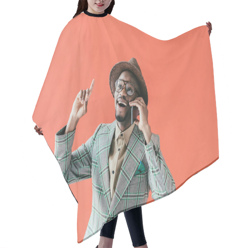 Personality  Excited African American Man Talking On Smartphone And Pointing Up With Idea, Isolated On Red  Hair Cutting Cape