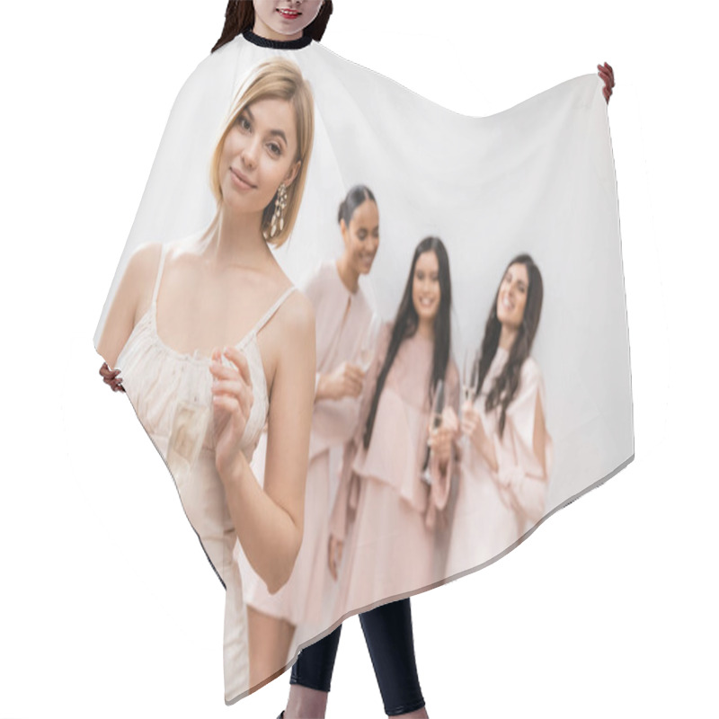 Personality  Cheerful Bride In Wedding Dress Holding Glass Of Champagne, Standing Near Blurred Interracial Bridesmaids On Grey Background, Happiness, Special Occasion, Blonde And Brunette Women  Hair Cutting Cape