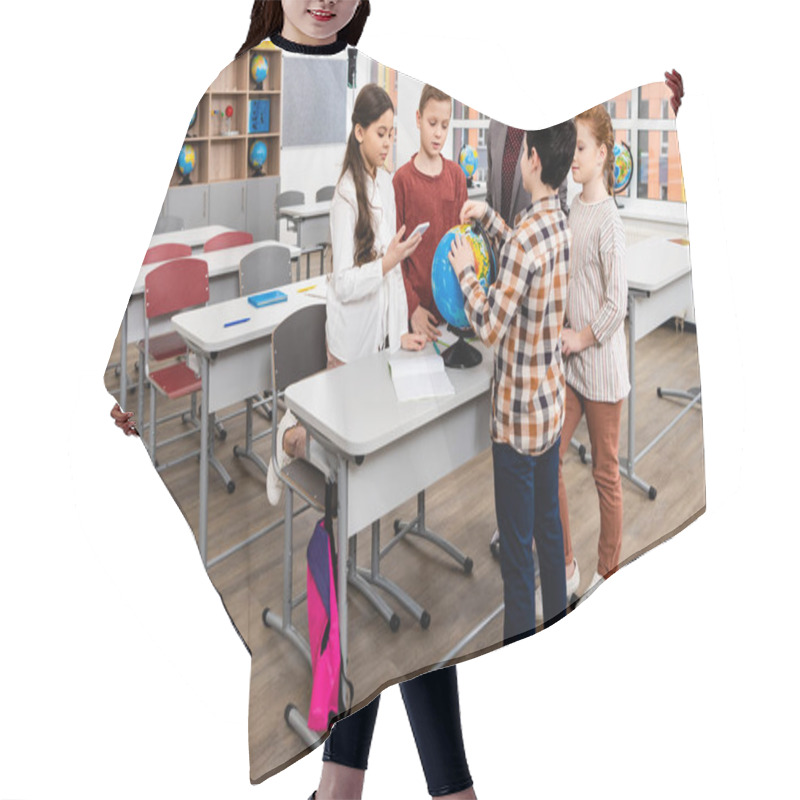 Personality  Teacher And Pupils Looking At Globe While Studying Geography In Classroom Hair Cutting Cape