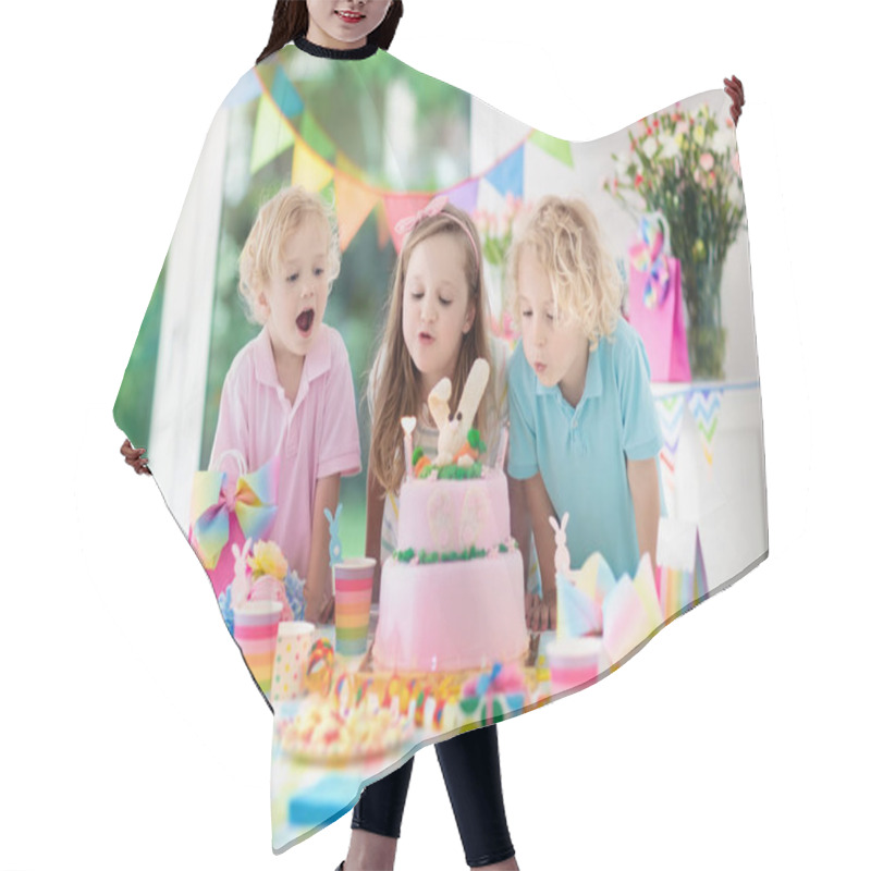 Personality  Kids Birthday Party. Children Blow Out Candles On Pink Bunny Cake. Pastel Rainbow Decoration And Table Setting For Kids Event, Banner And Flag. Girl And Boy With Birthday Presents. Family Celebration. Hair Cutting Cape