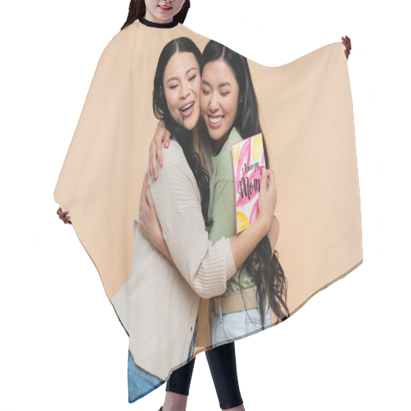 Personality  Asian Mother Holding Greeting Card And Hugging Happy Adult Daughter Isolated On Beige Hair Cutting Cape