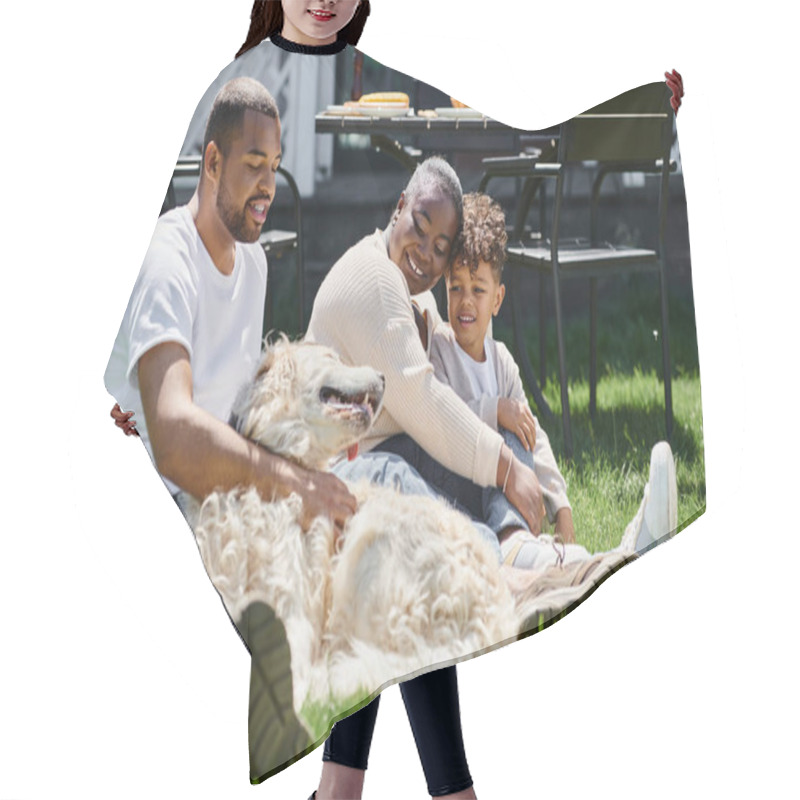 Personality  Quality Time Of Jolly African American Parents And Son Smiling And Sitting On Lawn And Petting Dog Hair Cutting Cape