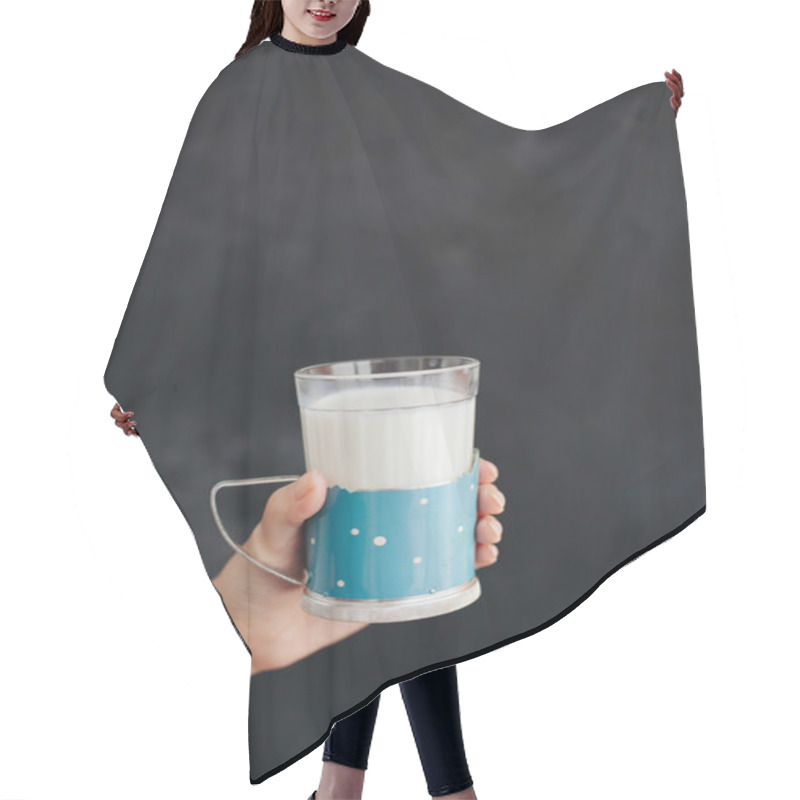 Personality  Woman Hand Keeps The Glass With Milk On Black Background Hair Cutting Cape