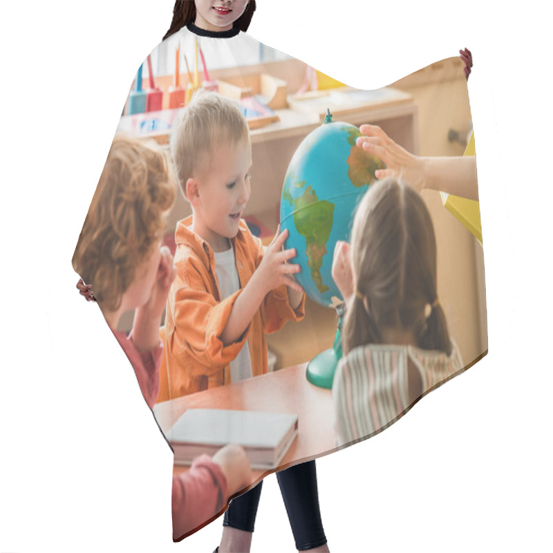 Personality  Amazed Boy Looking At Globe Near Blurred Teacher And Kids In Montessori School Hair Cutting Cape