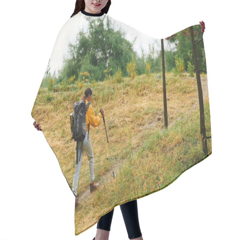 Personality  Enjoying The Crisp Autumn Air, A Young Woman Hikes Along A Forest Trail Adorned With Colorful Foliage. Hair Cutting Cape