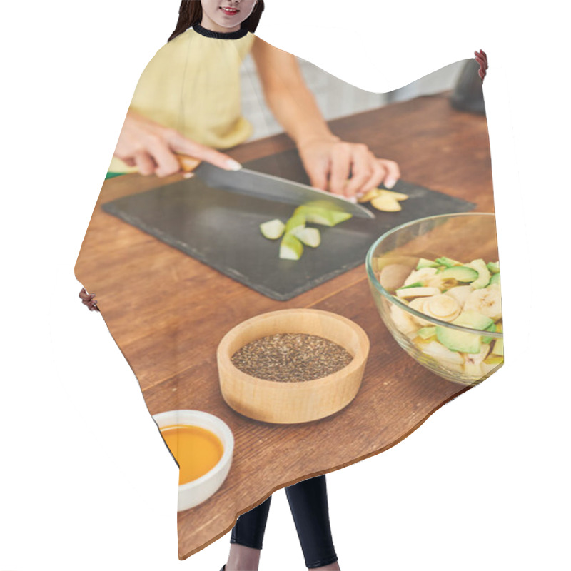 Personality  Cropped Woman Cutting Fresh Fruits While Preparing Vegetarian Salad Near Honey And Sesame Seeds Hair Cutting Cape