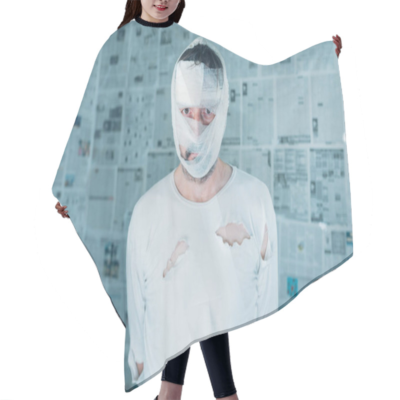 Personality  Victim Of Tabloid Journalism And Fake News Infodemic, Conceptual Image Of Man Wrapped In Bandages Surrounded By Walls Covered With Daily Newspaper Pages Hair Cutting Cape