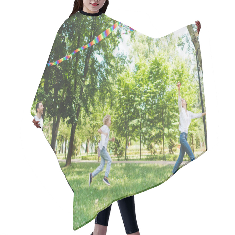 Personality  Excited Family Running And Playing With Flying Kite In Park During Daytime Hair Cutting Cape