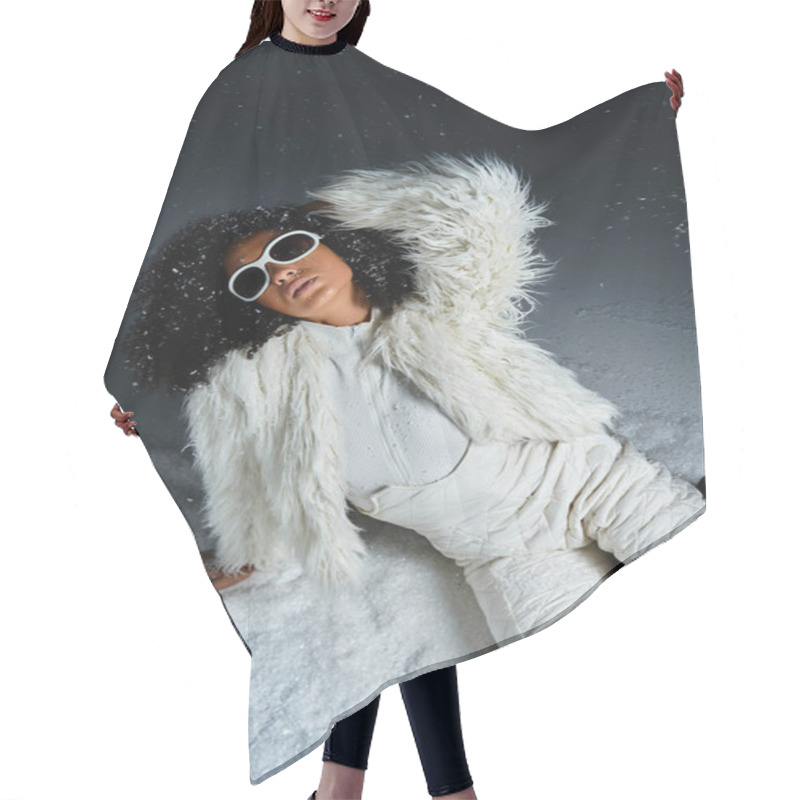 Personality  A Fashionable Woman Lounges In The Snow, Showcasing Her Stunning Winter Outfit And Glamorous Style. Hair Cutting Cape