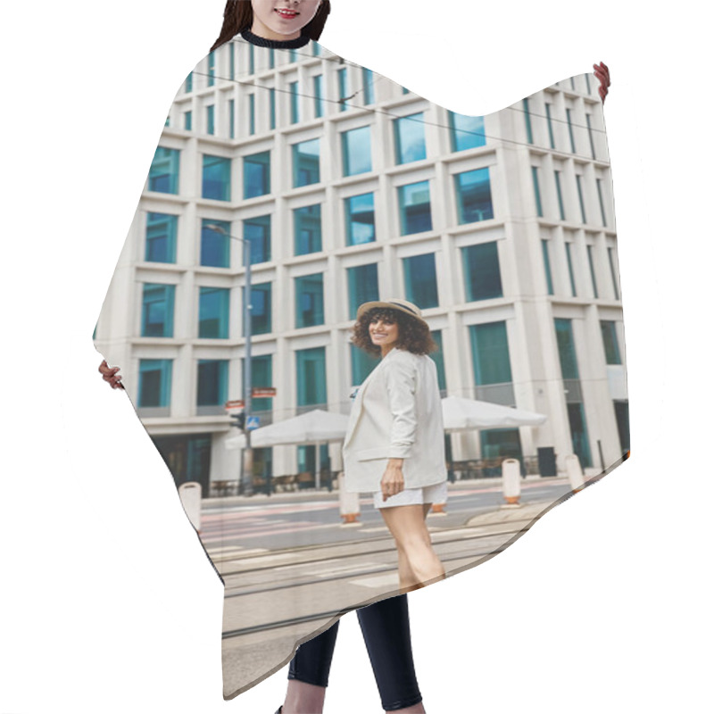 Personality  A Woman In A White Outfit Walks Across A Street In A European City. Hair Cutting Cape