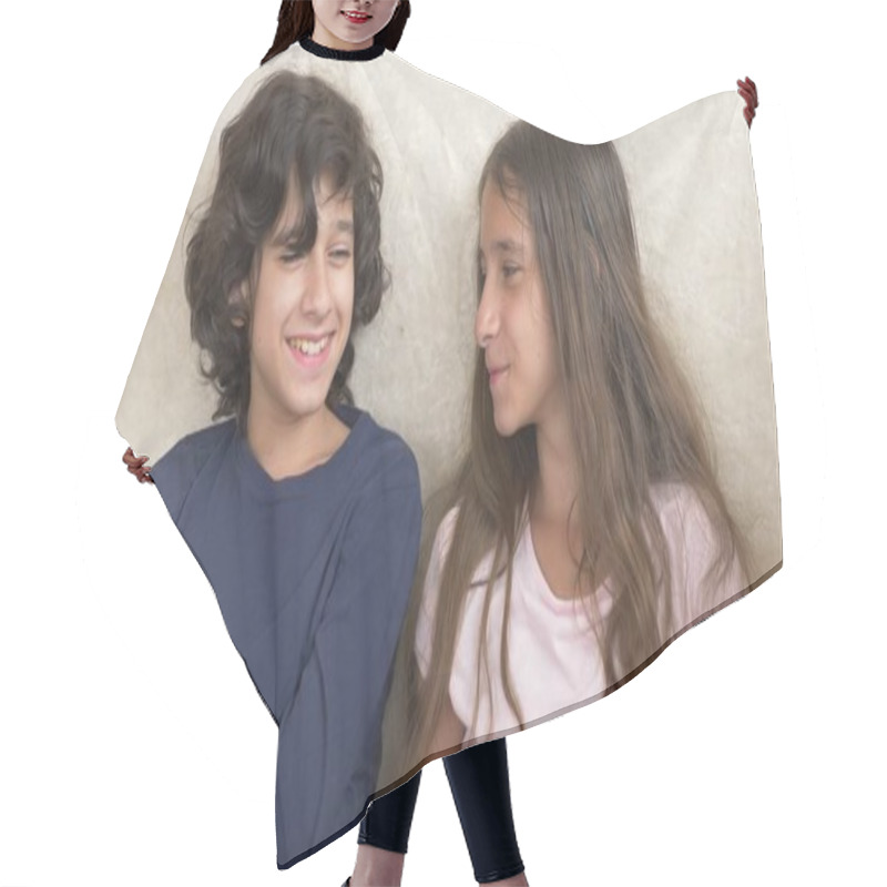 Personality  Portrait Of Adorable Brother And Sister, Teenagers Smiling And Laughing With Funny Expression On Their Faces. Family Happiness And Relations. Hair Cutting Cape