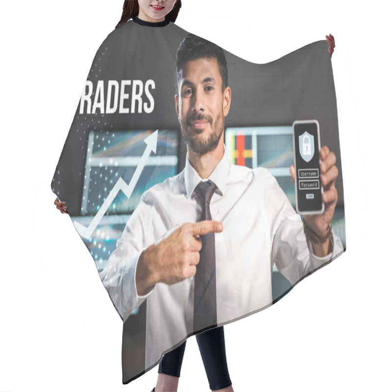 Personality  Happy Bi-racial Trader Pointing With Finger At Smartphone With Padlock  Hair Cutting Cape