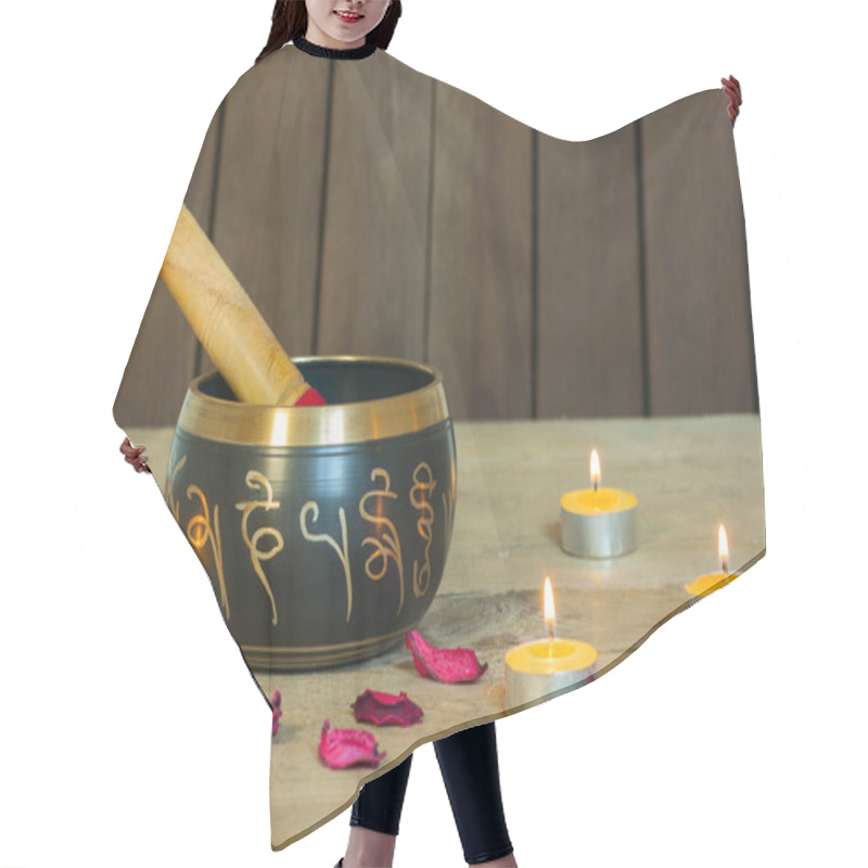 Personality  Studio Shot Of Tibetan Singing Bowls With Burning Candles Hair Cutting Cape