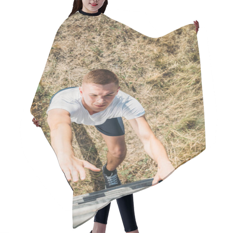 Personality  Overhead View Of Young Soldier Climbing Wooden Barrier During Obstacle Run On Range Hair Cutting Cape