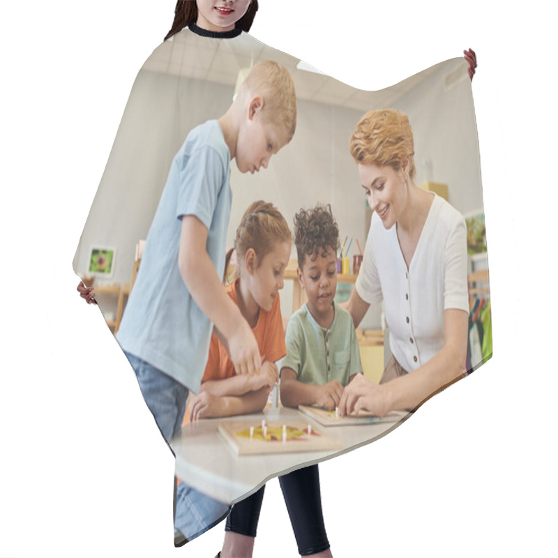 Personality  Smiling Teacher And Interracial Kids Playing With Didactic Material In Class In Montessori School Hair Cutting Cape