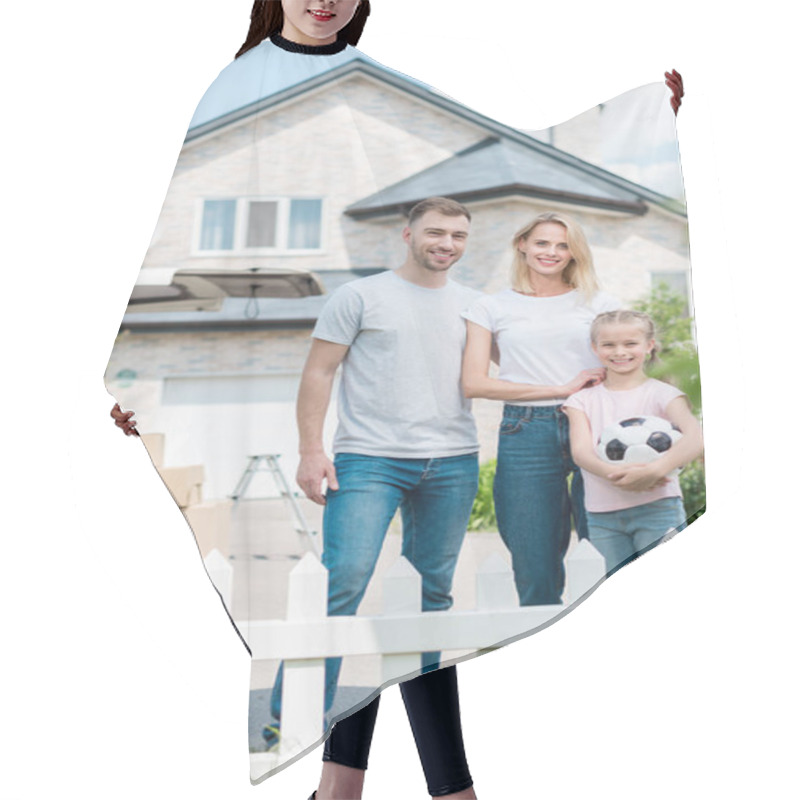 Personality  Front View Of Happy Family With Little Daughter Holding Soccer Ball In Front Of New House  Hair Cutting Cape