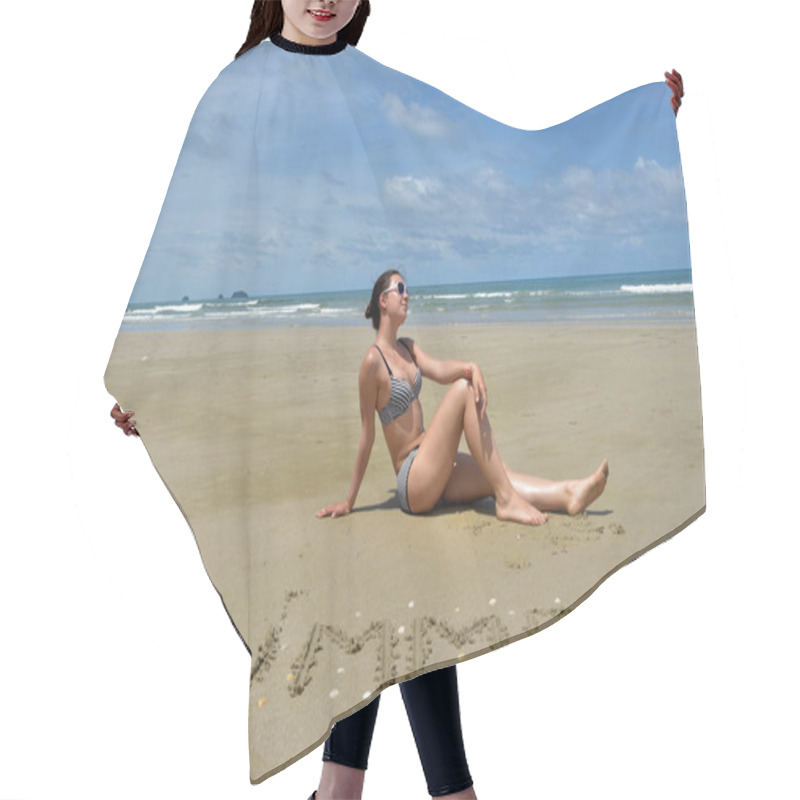 Personality  A Girl In A Swimsuit Sits On A Deserted Sandy Beach Next To The  Hair Cutting Cape